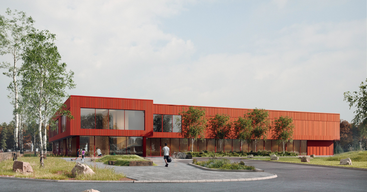 Bild på badhus med stora fönsterpartier och rödmålad fasad.